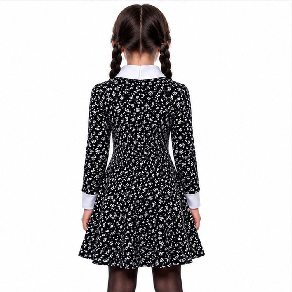 Back view of the black floral dress worn by a model